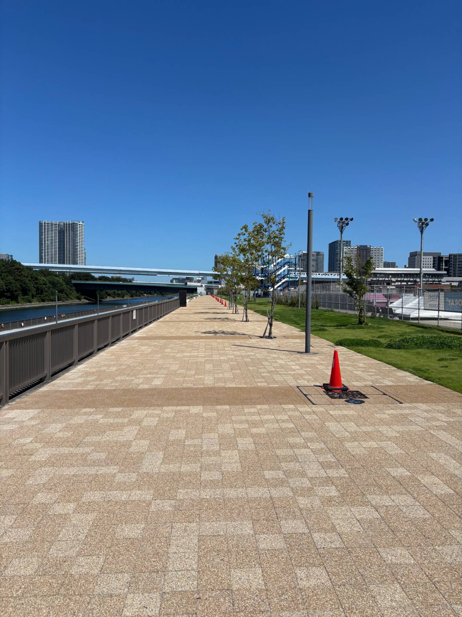 A long paved promenade beside the canal